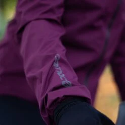 Carnac Women's Burgundy Waterproof Cycling Rain Jacket -Planetx Bike Store Close up sleeve